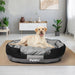 Dog happily sitting on the heavy duty waterproof dog bed