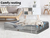 Dog relaxing on the dog bed settee​