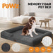 Dog sitting on the grey dog bed boucle