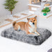 Dog sitting on the grey pawz-memory foam pet mat