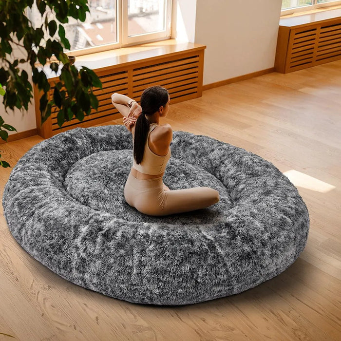 Girl doing yoga on the Human size bed