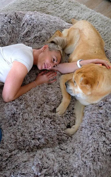 Lady with dog on The Human Size Nap Bed