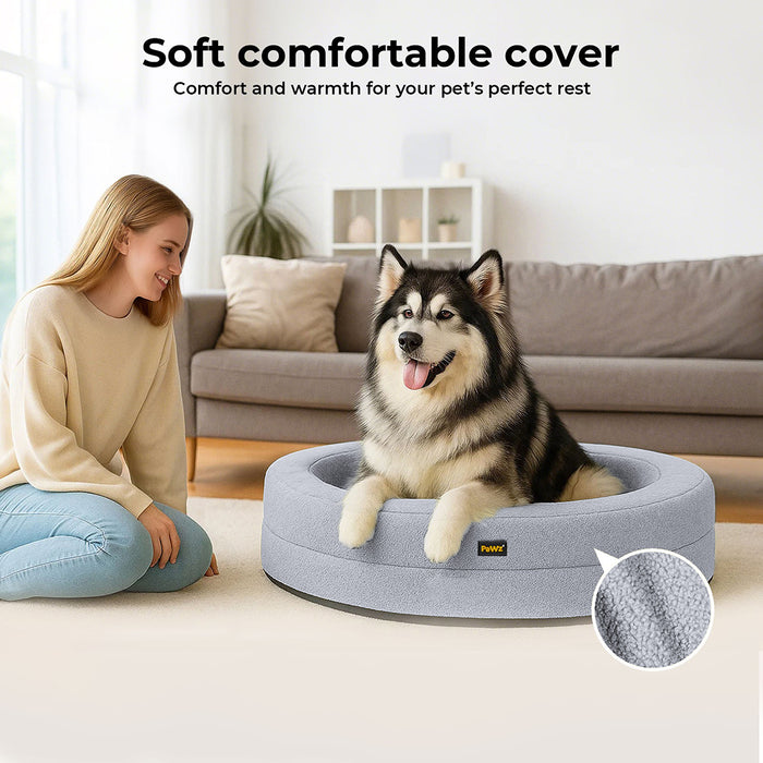 Large dog sitting in the Orthopedic Memory Foam Dog Donut Bed