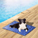 Medium size dog sitting on pet mat cooling​