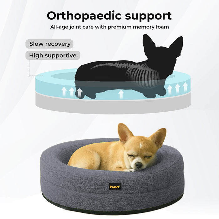 Puppy relaxing in the Orthopedic Memory Foam Dog Donut Bed Dark Grey