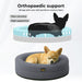 Puppy relaxing in the Orthopedic Memory Foam Dog Donut Bed Dark Grey