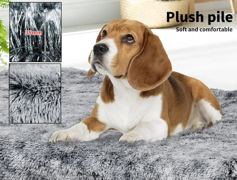 Puppy sitting on the pawz-memory foam dog crate mat
