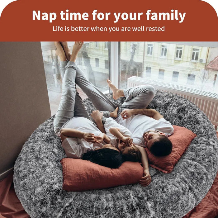 Small family resting on the Human size bed 