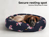 large dog relaxing on floral pet bed​