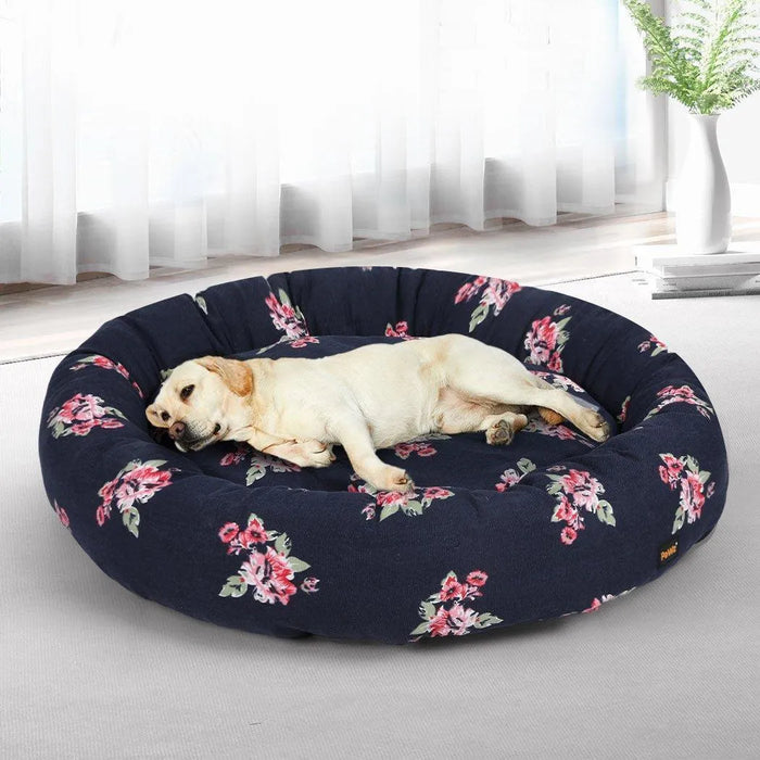 large dog sleeping on floral dog bed​
