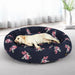 large dog sleeping on floral dog bed​