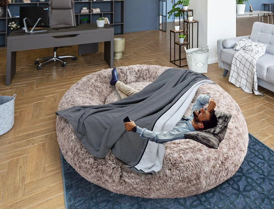 man on the The Human Size Nap Bed - 