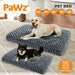two dog sitting on their calming dog bed​